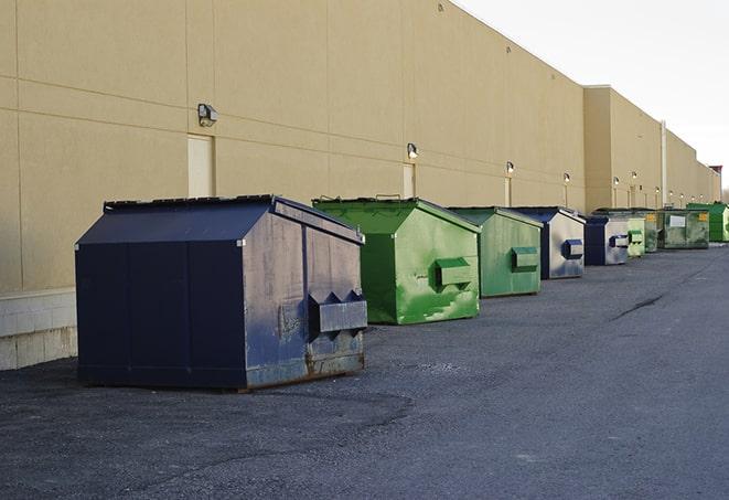 construction dumpsters stacked in a row on a job site in Hastings On Hudson